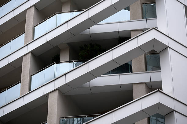 Balconies with a sleek design on a contemporary urban building reflect modern living.