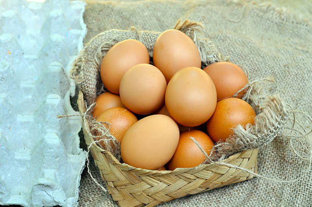 istock Fresh Brown Eggs in a Woven Basket 2251113879