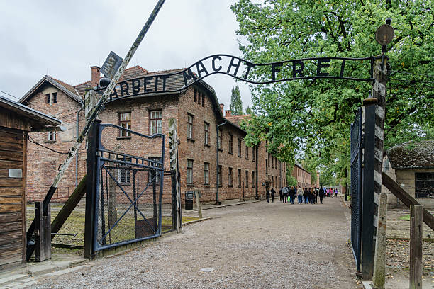 Auschwitz, Poland - September 23, 2025: The gate of the Auschwitz-Birkenau Concentration and Extermination Camp with the slogan, Arbeit macht frei, Work Sets You Free. Poland
