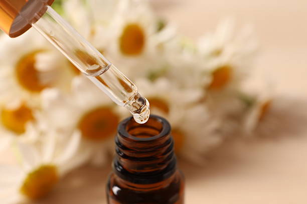 istock aroma oil from chamomile in a bottle on the table 2251124861