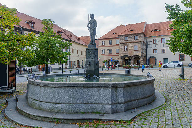 Prachatice, Czech Republic - September 28, 2025: View of the Velke Square, with a fountain, decorated buildings, locals and visitors, in Prachatice, the South Bohemian Region of the Czech Republic