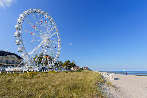 Kuhlungsborn, Germany - October 02, 2025: View of the Baltic Sea coast, with a Ferris wheel, in Kuhlungsborn, Mecklenburg-Vorpommern, northeast Germany