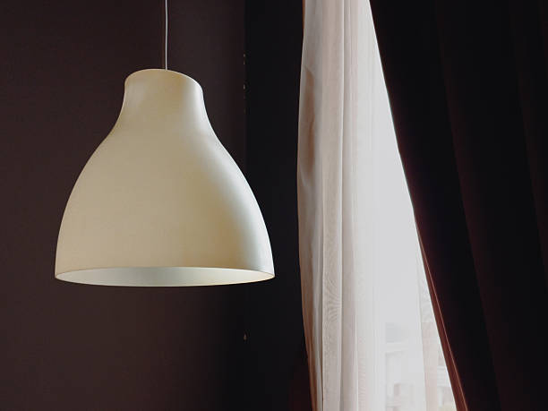white pendant light in the bedroom
