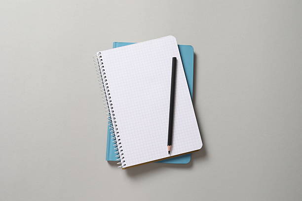 istock Flat lay with pencil and notebook on grey background, top view 2251145659