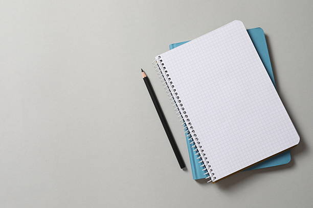 istock Flat lay with pencil and notebook on grey background, top view 2251145661