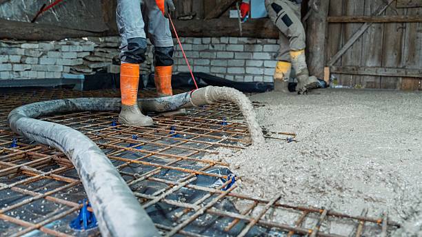 istock Pouring Concrete Slab Construction Worker Leveling Fresh Concrete for Foundation Project 2251149999