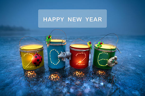 istock happy new year 2026 with tin lanterns at the beach 2251150143