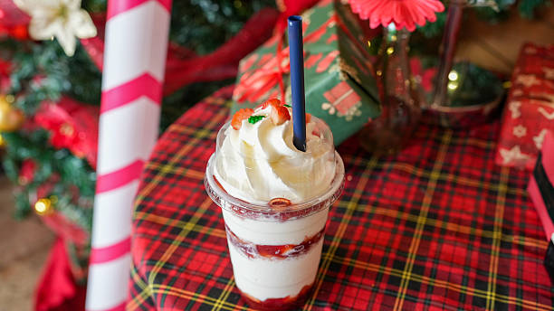 Refreshing Strawberry Dessert Drink with Whipped Cream Topped in Festive Holiday Setting