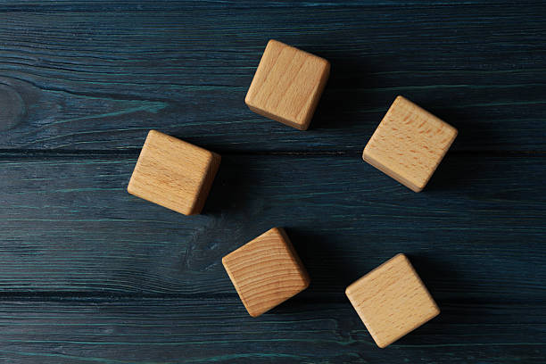 istock Blank wooden cubes for different concepts, top view 2251151555