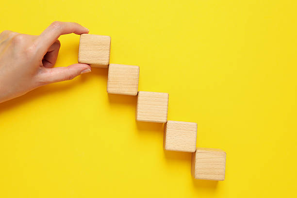 istock Blank wooden cubes for different concepts, top view 2251151802