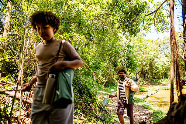 istock Father and son walking on nature 2251152439