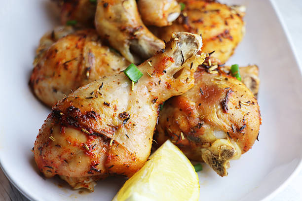 istock Golden Roasted Chicken Drumsticks with Lemon and Herbs 2251155876