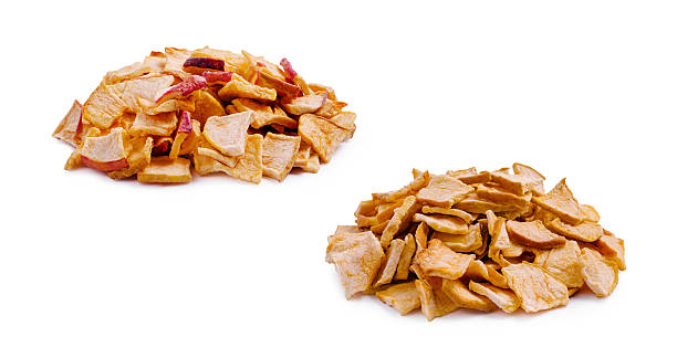 istock Dried apple slices arranged in two separate piles on a white background 2251160806