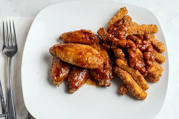 istock chicken wings   with chicken chilli fries 2251166224