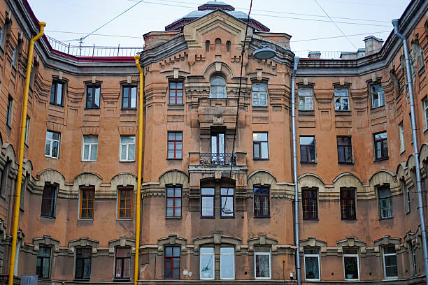 Weathered Residential Building Facade in an Urban Courtyard