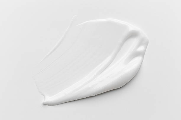 istock Cosmetic product smear white moisturizing lotion isolated on white, squeezed out and smeared portion of skincare cream product testing. 2251168182