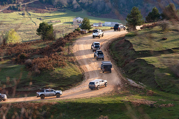 The off-road team is making their way through the mountains one after another.