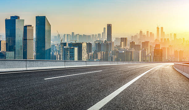 istock Asphalt road and modern buildings background 2251178112