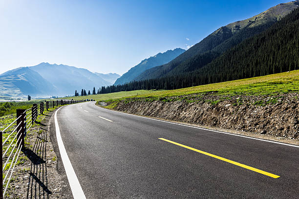 istock Asphalt road and mountain background 2251178643