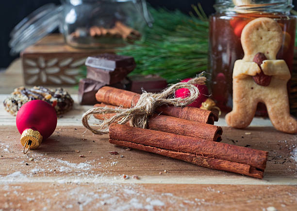 Cinnamon Sticks and Christmas Cookies on Rustic Holiday Table
