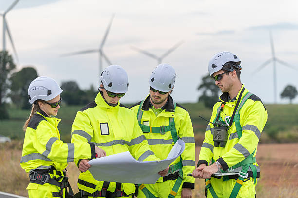 istock Engineers working on site in wind turbine farm, Wind turbines generate clean energy source, Eco technology for electric. 2251181376