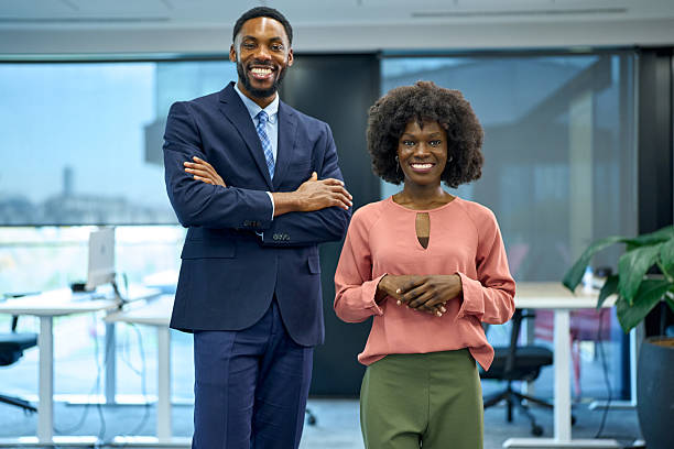 istock Diverse business partners standing together in modern office 2251188619