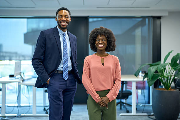 istock Diverse business professionals standing in modern office environment 2251188624