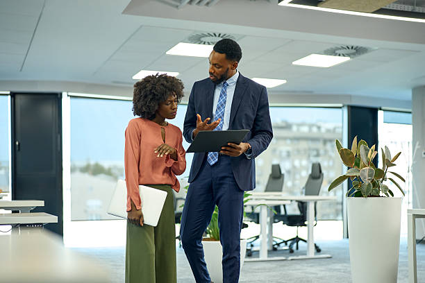 istock Business professionals having serious discussion in modern office 2251188647