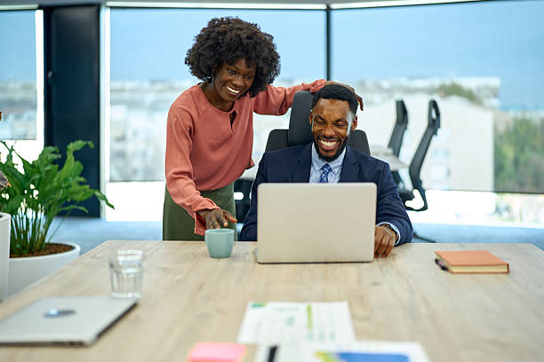 istock Diverse business colleagues laughing working together in office 2251188859