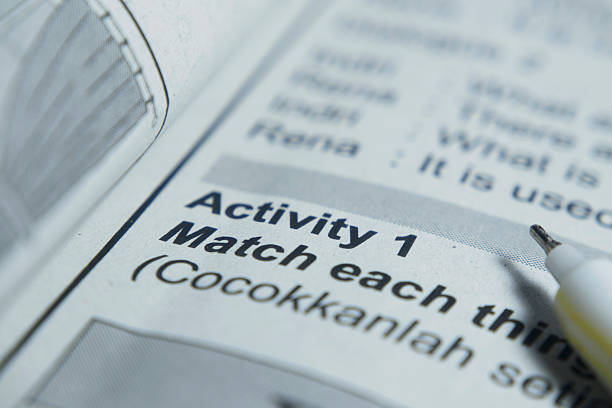 istock text book with focused of activity word 2251191438