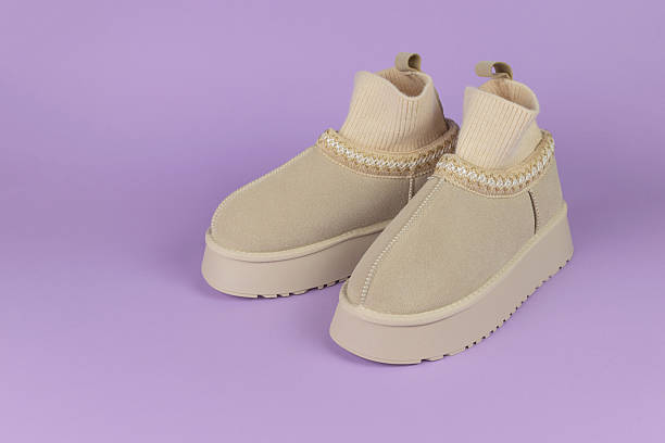 istock Beige Knit Ankle Boots with Platform Soles on Lavender Background 2251192497