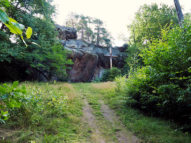 These sandstone rocks are a popular hiking and climbing site, known for their unusual rock formations, recesses (devil's fingerprints), and association with the Hermitage of St. Benedict.