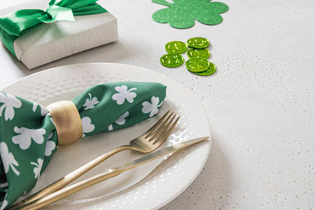 istock St Patricks day table setting with green shamrock,clover, traditional symbols 2251192662