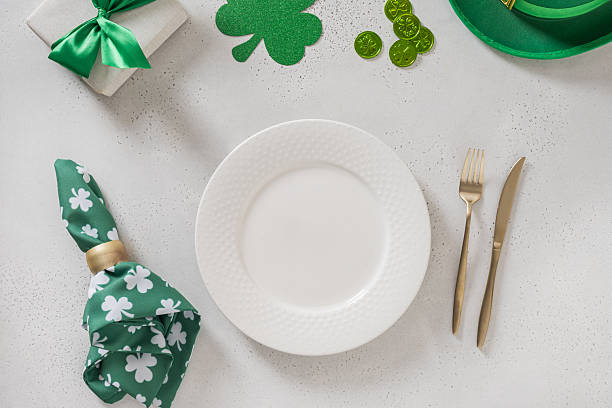 istock St Patricks day table setting with green shamrock,clover, traditional symbols 2251192664