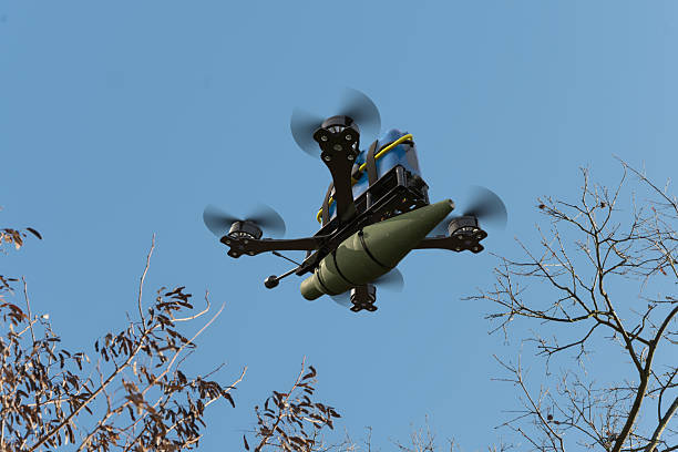 A modern drone flies with suspended ammunition.