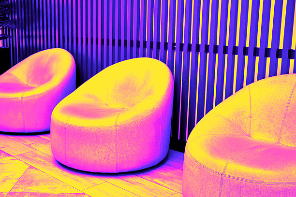 istock Three colorful armchairs create comfortable space in contemporary interior. Trendy neon tinting 2251198644
