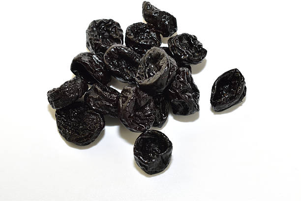istock A pile of dried plums, prunes. 2251198734