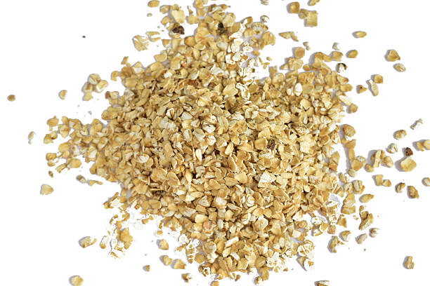 A small pile of oatmeal isolated on a white background.