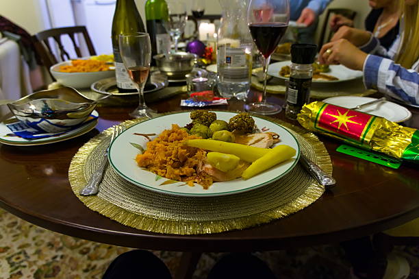 with defocused hands of people eating in the background