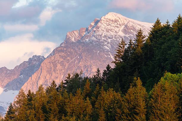 istock Snow covered mountain glowing in morning spring sunlight 2251201511