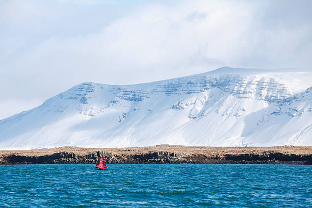 istock A tranquil seascape features a red buoy floating in a deep blue sea 2251201986