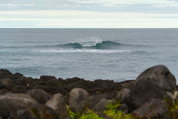 istock Breaking Ocean Waves Beyond Volcanic Shoreline 2251204043