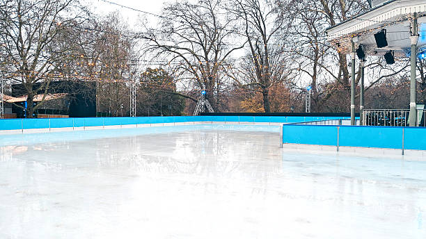 istock Quiet empty ice rink in winter decorated with Christmas lights and soft snow 2251206988