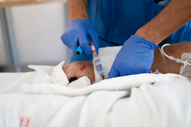 istock Nurse taking blood sample from patient in hospital 2251209455