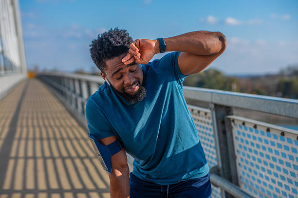 istock Tired man catching breath after intense workout 2251211224