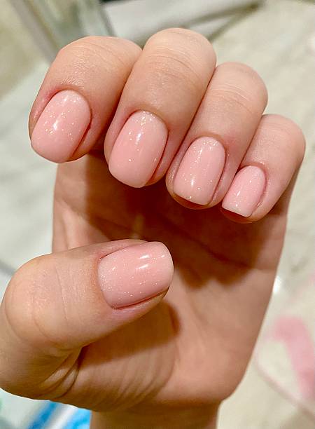 istock Soft Pink Gel Manicure with Subtle Glitter Shine. 2251214423