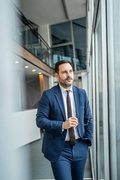 istock Confident businessman planning future in modern office building 2251215644