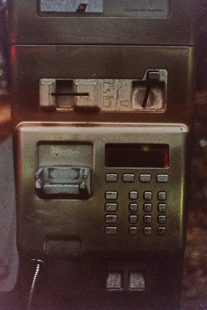 Dirty gritty keypad on a bropken public phone. Berlin, Germany.