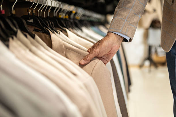 istock Mature Customer Selecting Elegant Jacket on Clothing Rack 2251220872