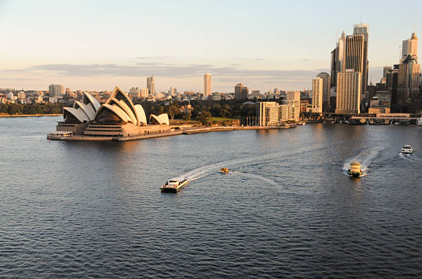 Sydney, Australia - August 13, 2009. Evening scene showing the sydney opera house and harbour area.